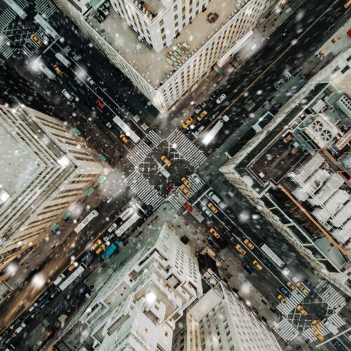 aerial view of snow falling in city