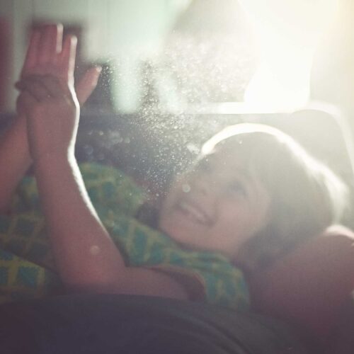 child smiling through opaque air