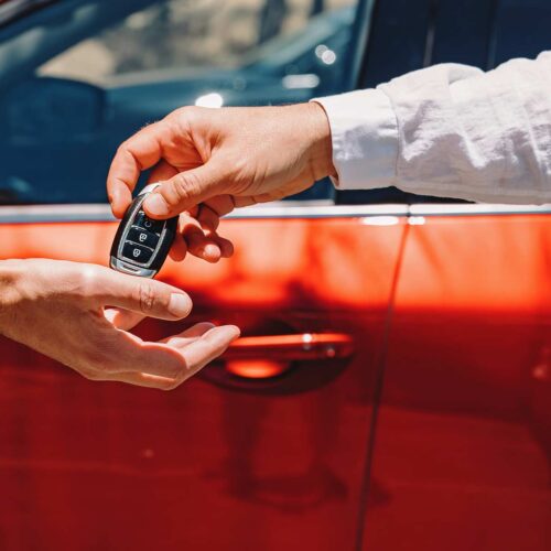 dealer giving car keys