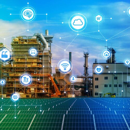 factory with solar panels in front and a digital overlay