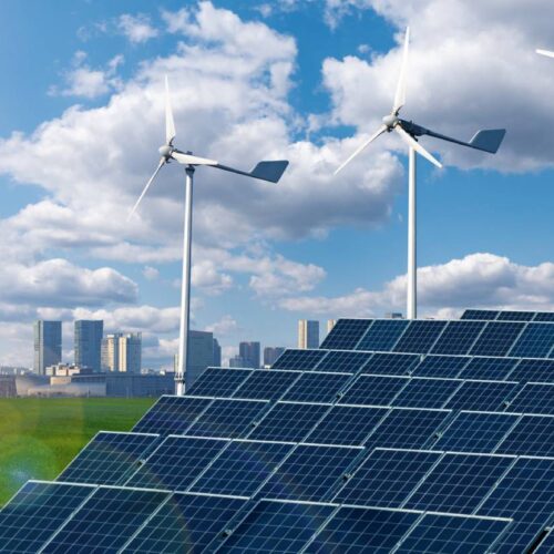 green city with solar panels and wind turbine