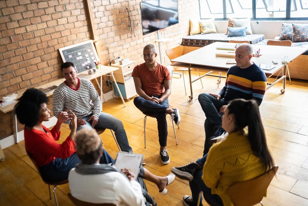 people in a circle meeting