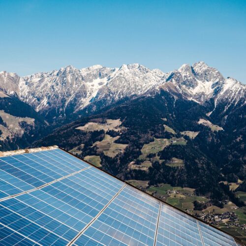 solar panels with mountains in the background