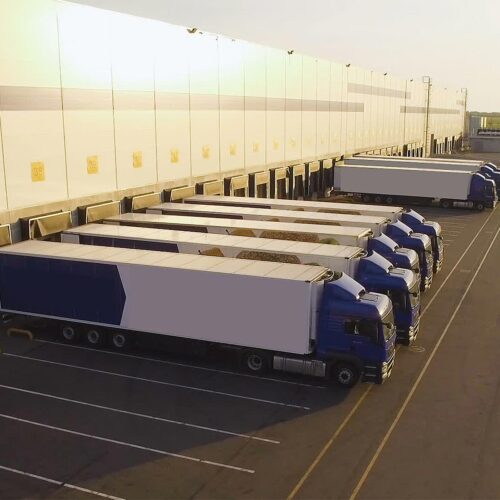 trucks parked at a distribution center
