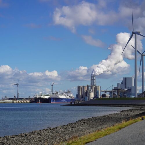 wind turbines with power plant on river
